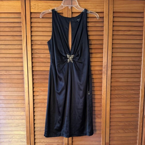 faux leather black dress Sleek Attitude Backless Mini & Windsor A woman in a SubCat:Satin-Dress Size:3T
